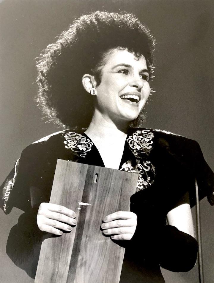 Photo of Lisa accepting her Rising Artist Award